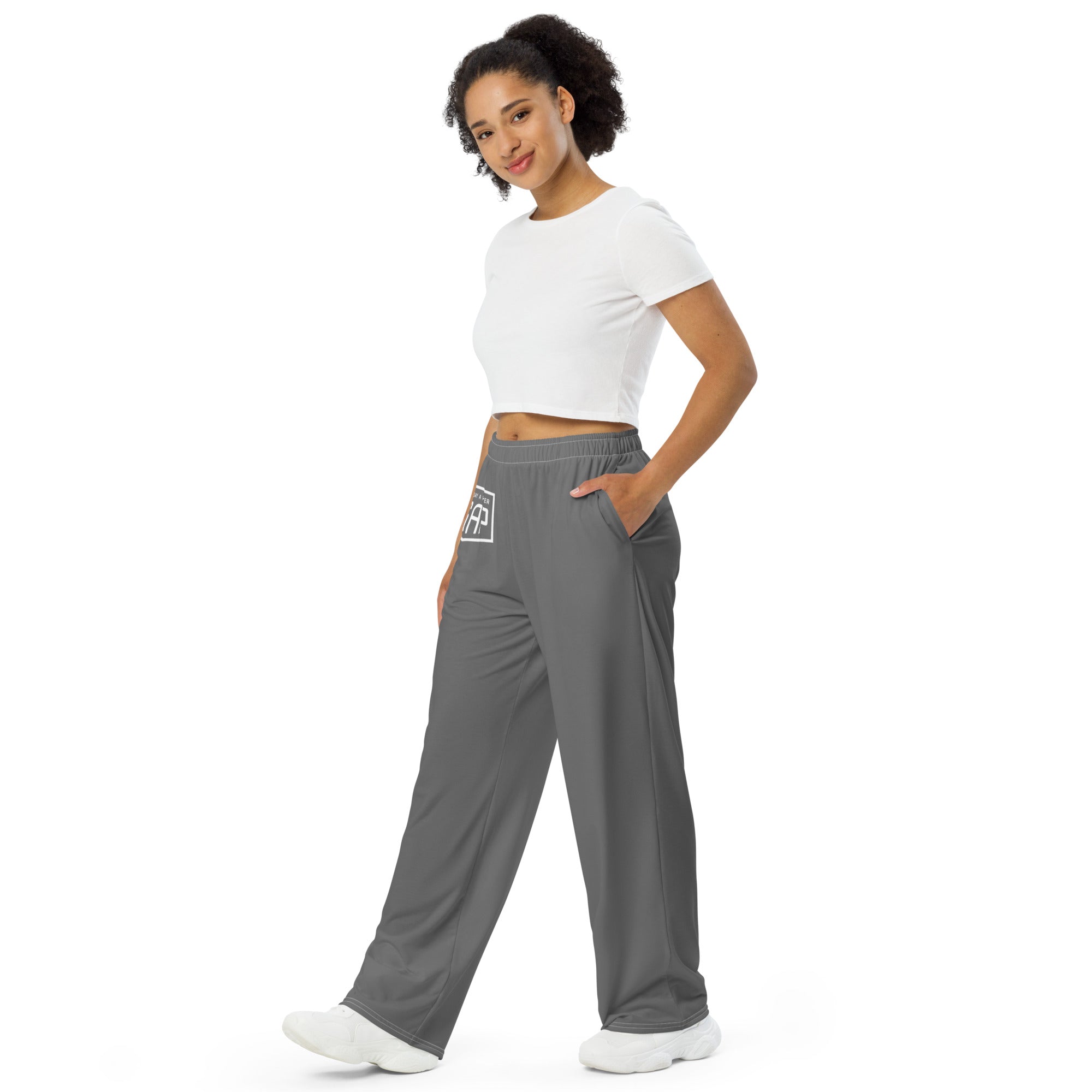 women wearing a gray all over print unisex wide leg with white asap print