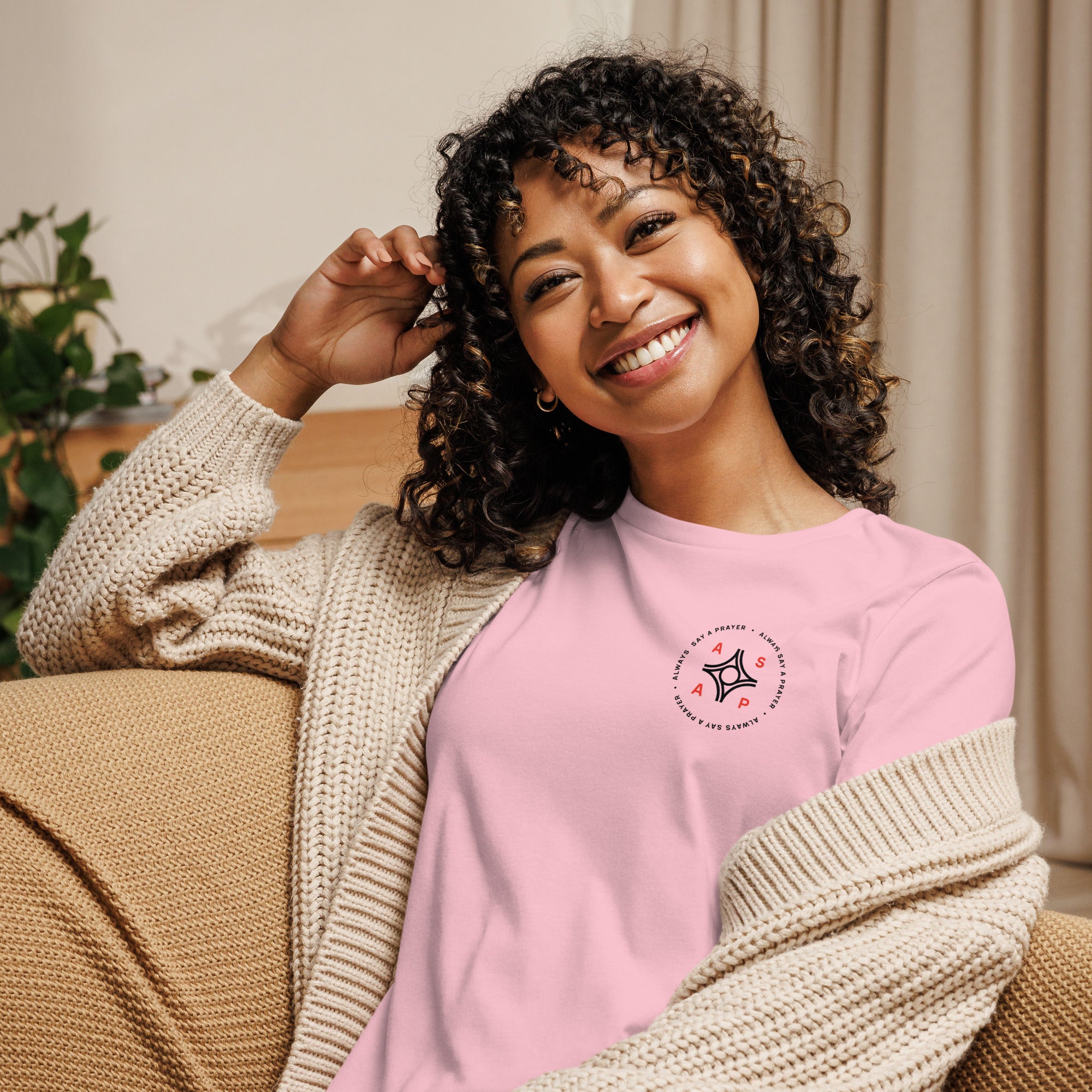 women wearing a pink relaxed t shirt with white asap print